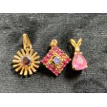 9ct gold pendants with red and pink stones