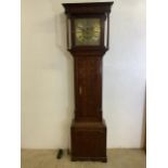 A Thomas Lister Georgian oak longcase clock with weight and pandulum. Brass face with later but