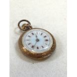 Small 14 carat gold pocket watch with enamel face. Untested.