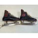 A pair of vintage leather ice skates, made in Canada. Marked 7.5.