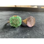 Two 9ct gold dress rings. Amethyst ring size S, green ring size N - one stone missing