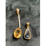 An Edwardian citrine drop pendant in un-marked yellow metal also with a jet pendant mounted in 9ct