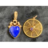 A hearted shaped lapis pendant set with seed pearls in un- hallmarked gold also with an un-