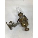 A vintage nautical style oil lamp on gimbal with decorative fish holder. Stamped Sherwood Birmingham