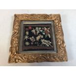 A naive hand embroidered sampler in gilded art nouveau style frame. Sampler dated 1803 W:15cm x H: