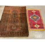 A small Persian rug with four central medallions also with a small decorative mat. Largest W:140cm x