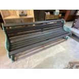 A large Victorian cast iron garden bench, three seater with later slats. W:251cm x D:80cm x H:87cm