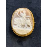 An oval cameo brooch depicting lady on lion in decorative gilt mount W:4.5cm x H:5.5cm