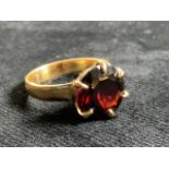 18ct gold ring set with a garnet. Width of stone 12mm. Ring size L