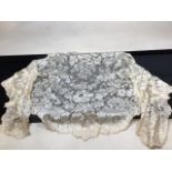 A nineteenth century lace shawl. Some discolouration