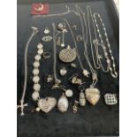 A collection of silver and plated necklaces, rings brackets and brooches.