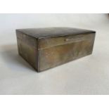 A silver hallmarked cigarette box. Hallmarks indistinct. Engraved inscription to lid form the Old