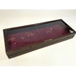 A Picquot ware wooden glazed shop display case with raised back legs for display purposes. W:66cm