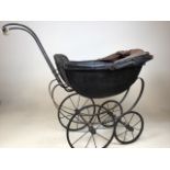 A Victorian dolls pram with hood H:70cm to top of handle