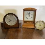 A Smiths Enfield early 20th century mantle clock also with an inlaid mantle clock and a brass