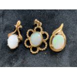 Three opal pendants set in 9ct gold. Total weight 5gm. Opals approx 9mm