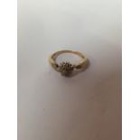 A nine carat gold diamond cluster ring. Size 9.5