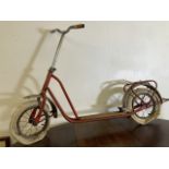 A vintage Rivel push-kick scooter mid century made in Holland.