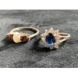Two silver rings - size N and size Q, one with an opal