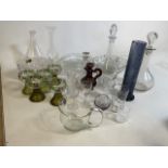 A mixed quantity of glass items including glasses, carafes, decanters, hock glasses and cranberry