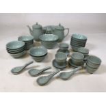 A twentieth Chinese Celadon dinner service decorated with fish, includes 16 bowls, 8 spoons, 12