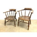 Two elm seated smokers bow arm chairs late 19th early 20th century. Seat heights H:38cm and H:43cm
