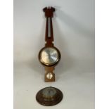 Two barometers. A Banjo barometer - made in Germany and a round model made in England