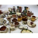 A large collection of Watcombe pottery Mottoware, and others