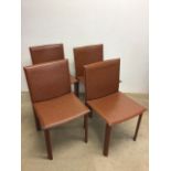 4 Sibau dining chairs, the tan upholstery saddle stitched with unusual dressed legs. Sticker to