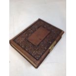 A leather bound antique photograph album part filled with cabinet cards. Includes royalty,