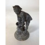 A weathered metal figurine of a gentleman H:28cm