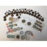 Assortment of coins and stamps. Coins from UK, Canada, United States and others. Includes 1889 Queen