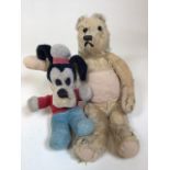 Two vintage teddies, a traditional bear and a Disney Goofy plush. Playworn condition.