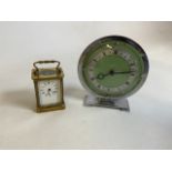 A brass carriage clock with key also with a chrome Art Deco style clock