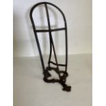 A Victorian wrought iron saddle rack. H:54cm