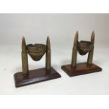 Pair of handmade trench art ashtrays. Ordnance shell casings with rotating artillery caps for ease