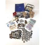 Large assortment of vintage and antique currency, with UK and worldwide coins and notes. Also with a