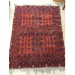 Large living room Bokhara rug with loose tassels. Red and navy blue patterns. Good condition.