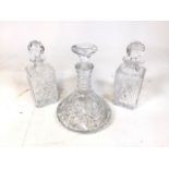 3 vintage cut glass decanters - two whiskey and one large spirit vessel. Faceted ball, and flat