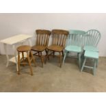 Assorted furniture, kitchen chairs, stools and a painted table.