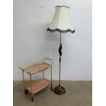 Mid century items. A metal serving trolley and a wood and metal standard lamp. Lamp untested H:146cm