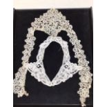 A quantity of vintage and antique lace including collar, insets, head coverings and trims also