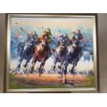 An original oil on canvas of racing horses in silvered frame. Signed lower right. W:70cm x H: