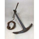 Vintage ships anchor, with decorative length of rope. Lightly weathered condition. W:51cm x D: