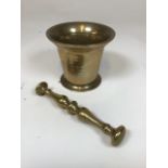 Antique mortar and pestle, polished brass. Good condition for age.