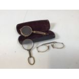 Articulated lorgnette opera glasses, with one other and a hand-held monocle. Original condition.