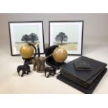 A pair of globe bookends, a Frith cat sculpture, a pair of elephants, tow prints and a set of