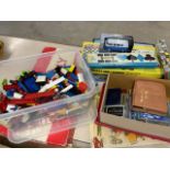 A box of assorted Lego also with board games, cards and books