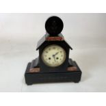 An art Devon black marble clock with engraved detail and highlights of pink marble W:29.5cm x H: