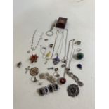A quantity of costume jewels including some silver and white metal items